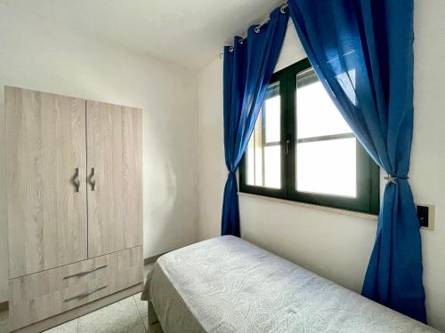 Postel nebo postele na pokoji v ubytování Casa Artemide - Primo piano indipendente con vista mare