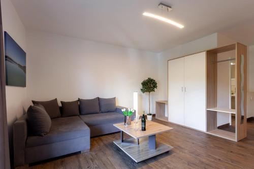 Posezení v ubytování Alpenlodge Lechbruck Allgäu - Ferienwohnung 18