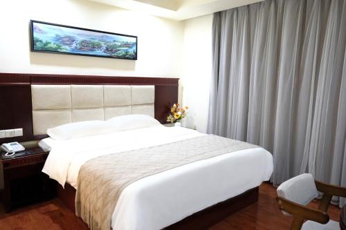 Tempat tidur dalam kamar di Huahang Hotel (Guangzhou New Baiyun International Airport)