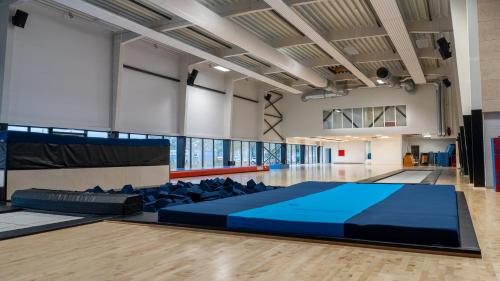 a large room with a large bed in the middle of a floor at Jetsmark Idrætscenter in Pandrup