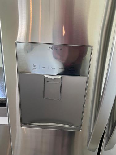 a refrigerator with its door open with a picture in it at Wellington House in Nanaimo