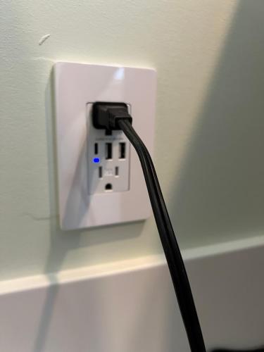 a black cord plugged into a light switch at Wellington House in Nanaimo