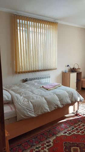 En eller flere senger på et rom på Гостевой дом
