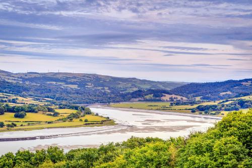 a view of a river with hills in the background at The Manor Boutique Hotel Restaurant and Bar in Conwy