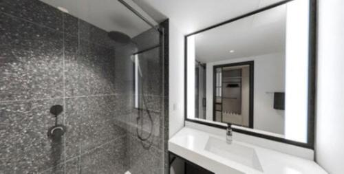 a bathroom with a sink and a mirror at Palmetto Marriott Resort & Spa in Palmetto
