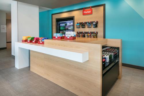 a store checkout counter in a store at Avid Hotels - Roseville - Minneapolis North by IHG in Roseville