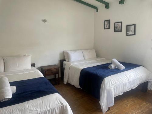 Ένα ή περισσότερα κρεβάτια σε δωμάτιο στο Celeste Villa de Leyva