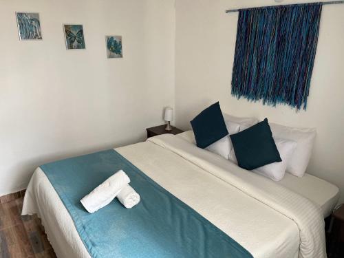Ένα ή περισσότερα κρεβάτια σε δωμάτιο στο Celeste Villa de Leyva