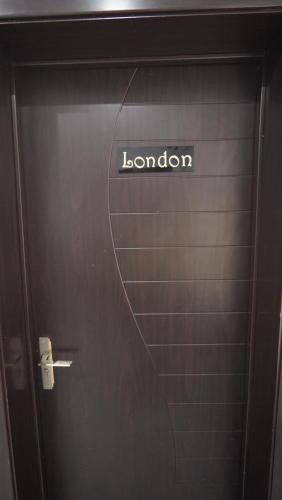 a door with the word london written on it at SHORTLETMART Guest House in Lekki