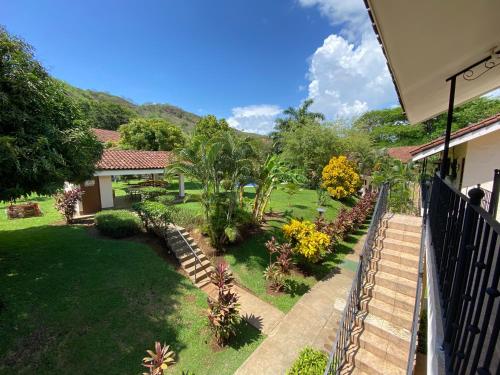 a house with a garden with trees and plants at Tucan Studio Ocotal in Coco