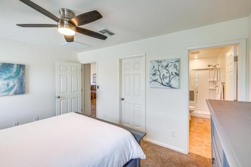 a bedroom with a bed and a ceiling fan at Backyard Oasis Updated San Tan Valley Escape in San Tan Valley