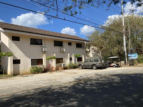 a car parked in front of a house at Tucan Studio Ocotal in Coco
