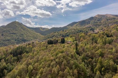 an aerial view of a forest with mountains at La Terrazza sui Monti in Castiglione dʼIntelvi