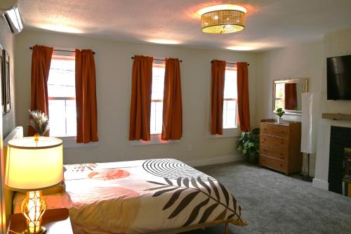 a bedroom with a bed with a zebra blanket at Bridge City Row House in Pittsburgh
