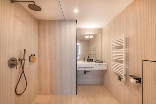 a bathroom with a sink and a shower at Maison du Moulin Vert in Paris