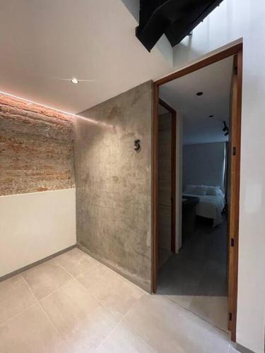 a room with a door leading to a bedroom at Casa Valentina Habitación 5 in Aguascalientes