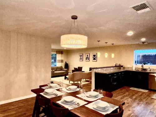 a dining room and living room with a table and chairs at Sunrise View in Rocklin