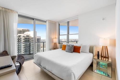 a bedroom with a large bed and a large window at High Floor Corner 2 BDR in Hyde Resort in Hollywood