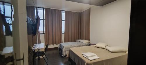 Voodi või voodid majutusasutuse Pousada Sol Pato Branco toas