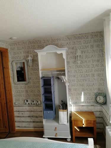 a room with a wall with writing on it at Ferienhaus Rosaly in Stolberg