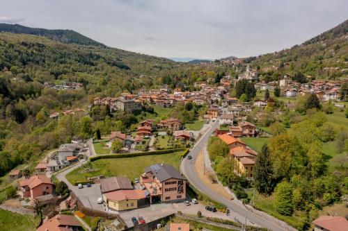 an aerial view of a small town in the mountains at La Terrazza sui Monti in Castiglione dʼIntelvi