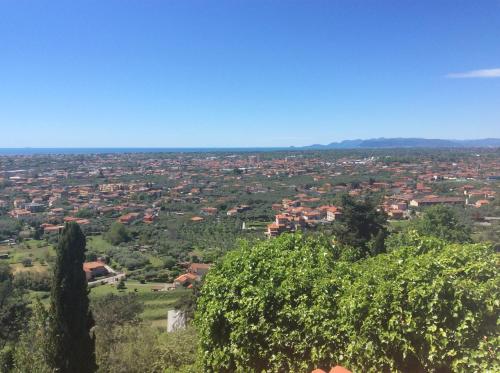 a view of a city with houses and trees at Belvedere 10 in Pietrasanta