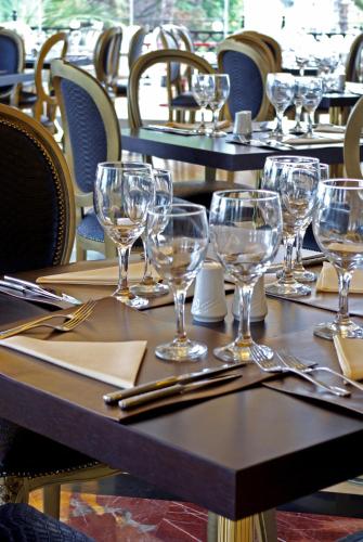 a group of tables with wine glasses on them at Mediterranean Princess- Adults Only in Paralia Katerinis