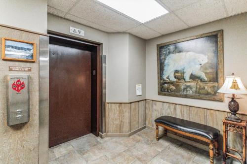 a waiting room with a bear painting on the wall at Handsome 2BR Condo with Gorgeous Views in Sugar Mountain! condo in Sugar Mountain
