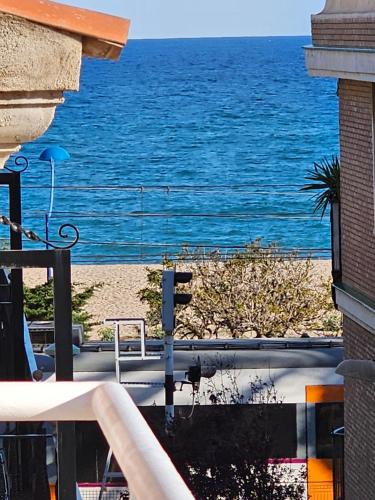 a view of the ocean from a balcony at La Pilona Beach Hostel in Malgrat de Mar