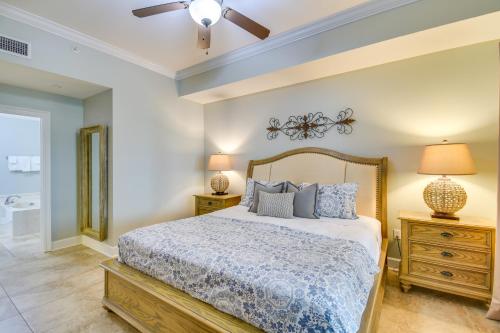 a bedroom with a bed and a ceiling fan at Oceanfront Orange Beach Condo with View and Pool! in Orange Beach