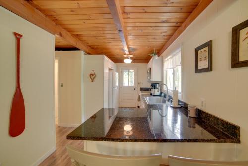 a kitchen with a large counter top in a room at 5 Mi to Fox State Forest Lakefront Home with Dock in Henniker