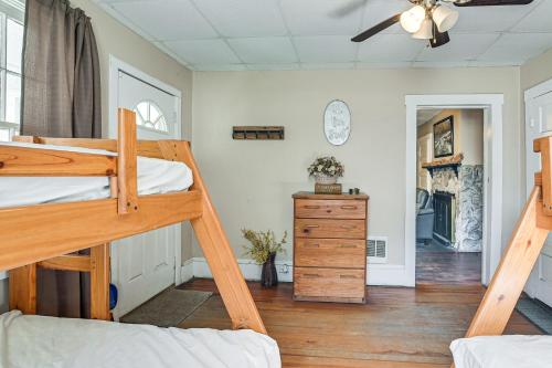 a bedroom with two bunk beds and a ceiling fan at Spacious West Virginia Home Ride to ATV Trails! 