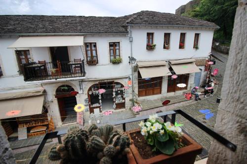 an aerial view of a building with flowers in a courtyard at Grey Stone in Gjirokastër