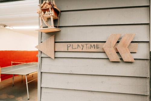 a sign that says playtime on the side of a house at Luxury Mountain Getaway in Pickens