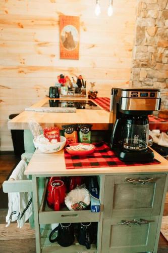 a kitchen with a counter with a coffee maker on it at Luxury Mountain Getaway in Pickens