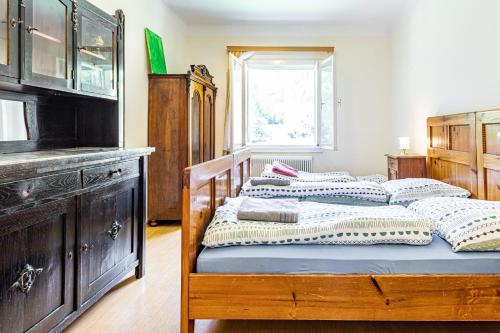 a bedroom with two beds and a dresser at Mountain Horse Ranch Vienna Alps 