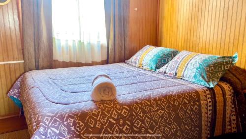 Кровать или кровати в номере Hospedaje Familiar Doña Juanita