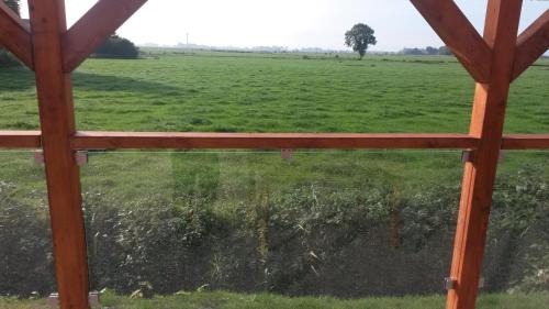 a view of a field from a window at Ferienwohnung 1 - a72143 in Wangerland