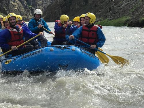 a group of people in a raft on a river at Bakkaflöt Guesthouse in Varmahlid