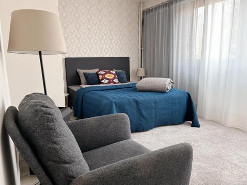 Postel nebo postele na pokoji v ubytování Hamina City Apartments