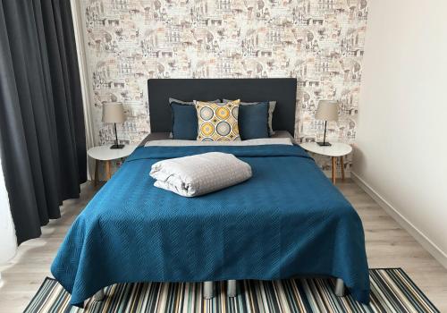 Postel nebo postele na pokoji v ubytování Hamina City Apartments