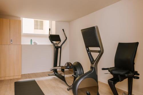 a room with two exercise bikes and a treadmill at Yelo Mozart powered by Sonder in Nice