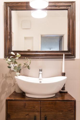 a bathroom with a white sink and a mirror at Nice Sopot in Sopot