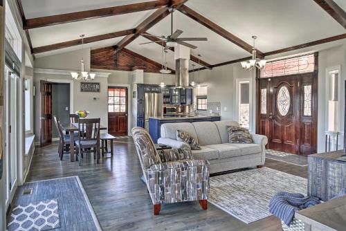 a living room with a couch and a table at Pet-Friendly Branson Area Home Hot Tub, Game Room in Reeds Spring