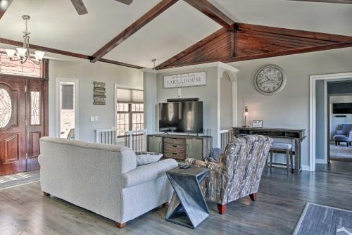 a living room with a couch and a tv at Pet-Friendly Branson Area Home Hot Tub, Game Room in Reeds Spring