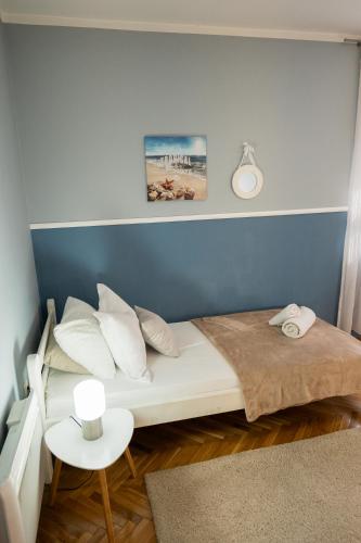 Postel nebo postele na pokoji v ubytování Apartman Emina