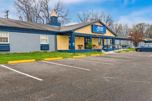 a parking lot in front of a building at Americas Best Value Inn Carlisle in Carlisle