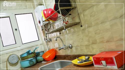 a kitchen with a sink with a toy boat on it at Halla Matrouh Al Bosphorus in Marsa Matruh