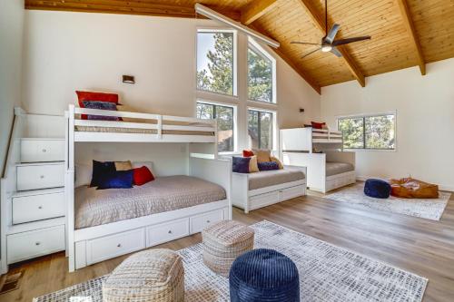 a bedroom with a bunk bed and a couch at Family Friendly Modern Cabin in Munds Park! in Munds Park