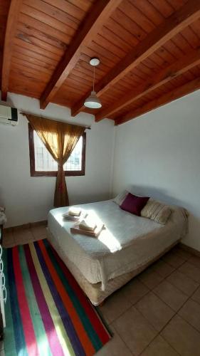 A bed or beds in a room at La casa del árbol
